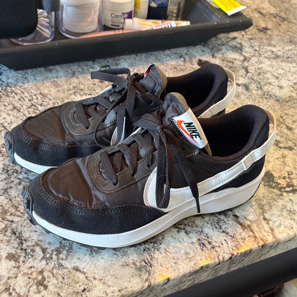 Nike women’s size 8 Black and White Athletic Sneakers